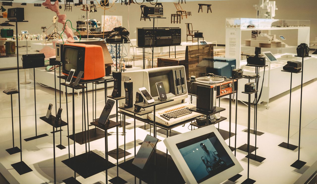 services-02 Showcase of vintage electronics in a modern museum setting.